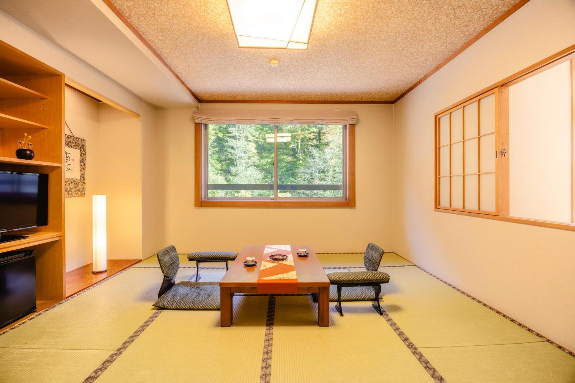 Отель Shikishimaso Higashikawa Экстерьер фото
